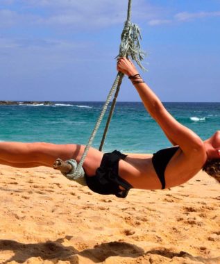 girl swing in sri lanka beach