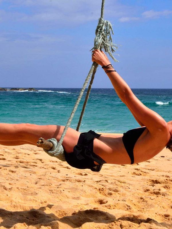 girl swing in sri lanka beach